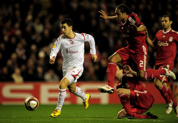 LIVERPOOL, ENGLAND - MARCH 18:  Eden Hazard of Lille breaks clear of the challenge of Glen Johnson of Liverpool during the UEFA Europa League Round of 16, second leg match at Anfield on March 18, 2010 in Liverpool, England.  (Photo by Shaun Botterill/Gett