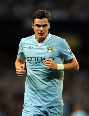 MANCHESTER, ENGLAND - AUGUST 15:  Adam Johnson of Manchester City looks on during the Barclays Premier League match between Manchester City and Swansea City at Etihad Stadium on August 15, 2011 in Manchester, England.  (Photo by Chris Brunskill/Getty Imag