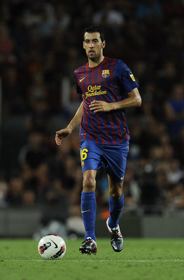 BARCELONA, SPAIN - AUGUST 29:  Sergio Busquets of FC Barcelona runs with the ball during the La Liga match between FC Barcelona and Villarreal CF at Camp Nou on August 29, 2011 in Barcelona, Spain.  (Photo by David Ramos/Getty Images)