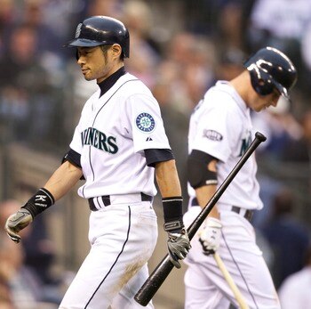 SEATTLE, WA - SEPTEMBER 17: Ichiro Suzuki #51 of the Seattle Mariners walks off the field after striking out against the Texas Rangers during a game at Safeco Field on September 17, 2011 in Seattle, Washington. (Photo by Stephen Brashear/Getty Images)