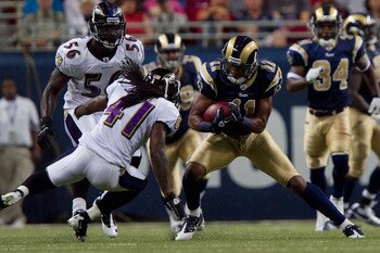 ST. LOUIS - SEPTEMBER 2: Brandon Gibson #11 of the St. Louis Rams looks to get past Travis Fisher #41 of the Baltimore Ravens during an NFL preseason game at the Edward Jones Dome on September 2, 2010 in St. Louis, Missouri.  (Photo by Dilip Vishwanat/Get