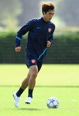 ST ALBANS, ENGLAND - SEPTEMBER 12:  Ju Young Park of Arsenal dribbles with the ball during a training session ahead of their UEFA Champions League Group match against Borussia Dortmund at London Colney on September 12, 2011 in St Albans, England. (Photo b