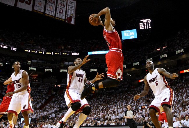 MIAMI, FL - MAY 24:  Derrick Rose #1 of the Chicago Bulls goes up for a dunk against Mario Chalmers #15, Udonis Haslem #40 and LeBron James #6 of the Miami Heat in the first half of Game Four of the Eastern Conference Finals during the 2011 NBA Playoffs o