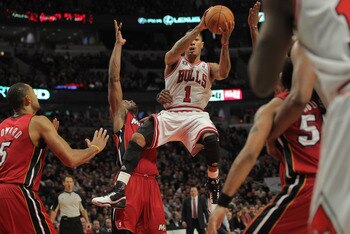 CHICAGO, IL - JANUARY 15:  Derrick Rose #1 of the Chicago Bulls drives with the ball against the Miami Heat at the United Center on January 15, 2011 in Chicago, Illinois. NOTE TO USER: User expressly acknowledges and agrees that, by downloading and or usi