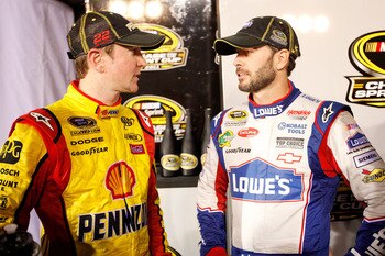 RICHMOND, VA - SEPTEMBER 10:  Jimmie Johnson, driver of the #48 Lowe's/Power of Pride Chevrolet, shakes hands with Kurt Busch, driver of the #22 Shell/Pennzoil Dodge, after the NASCAR Sprint Cup Series Wonderful Pistachios 400 at Richmond International Ra