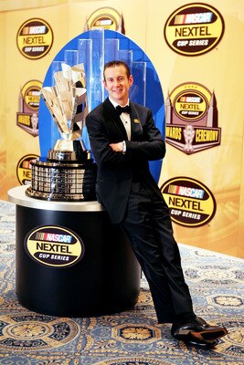 NEW YORK - DECEMBER 3:  Kurt Busch, 2004 NASCAR NEXTEL Cup Series Champion poses with the NASCAR NEXTEL Cup trophy after the awards banquet on December 3, 2004 in New York, New York. (Photo by Jamie Squire/Getty Images for NASCAR)