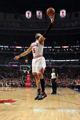CHICAGO, IL - MAY 26:  Carlos Boozer #5 of the Chicago Bulls controls a rebound against the Miami Heat in Game Five of the Eastern Conference Finals during the 2011 NBA Playoffs on May 26, 2011 at the United Center in Chicago, Illinois. The Heat won 83-80