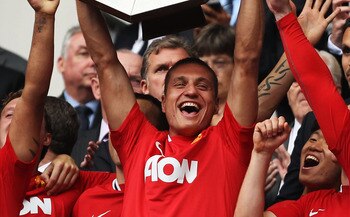 LONDON, ENGLAND - AUGUST 07:  Nemanja Vidic of Manchester United lifts the Community Shield after victory in the FA Community Shield match sponsored by McDonald's between Manchester City and Manchester United at Wembley Stadium on August 7, 2011 in London