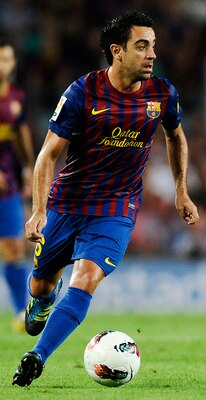 BARCELONA, SPAIN - SEPTEMBER 17:  Xavi Hernandez of FC Barcelona runs with the ball during the La Liga soccer match between FC Barcelona and CA Osasuna at Camp Nou Stadium on September 17, 2011 in Barcelona, Spain. FC Barcelona won 8-0 and Lionel Messi sc