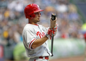 MILWAUKEE, WI - SEPTEMBER 8:  Shane Victorino #8 of the Philadelphia Phillies warms up for his first at bat in their game opener against the  Milwaukee Brewers  at Miller Park on September 8, 2011 in Milwaukee, Wisconsin. The Phillies beat the Brewers 7-2