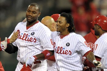 PHILADELPHIA, PA - SEPTEMBER 15: Ryan Howard #6 and Michael Martinez #19 of the Philadelphia Phillies celebrate after beating the Florida Marlins 2-1 in extra innings on a double by Howard and run by Martinez at Citizens Bank Park on September 15, 2011 in