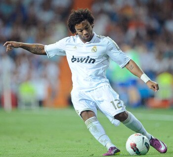 MADRID, SPAIN - SEPTEMBER 10:  Marcelo of Real Madrid crosses the ball during the La Liga match bewteen Real Madrid and Getafe at Estadio Santiago Bernabeu on September 10, 2011 in Madrid, Spain.  (Photo by Denis Doyle/Getty Images)