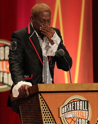 SPRINGFIELD, MA - AUGUST 12:   Dennis Rodman reacts during the Basketball Hall of Fame Enshrinement Ceremony at Symphony Hall on August 12, 2011 in Springfield, Massachusetts. (Photo by Jim Rogash/Getty Images)