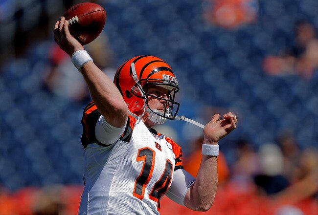 DENVER, CO - SEPTEMBER 18:  Quarterback Andy Dalton #14 of the Cincinnati Bengals warms up before a game against the Denver Broncos at Sports Authority Field at Mile High on September 18, 2011 in Denver, Colorado. (Photo by Justin Edmonds/Getty Images)