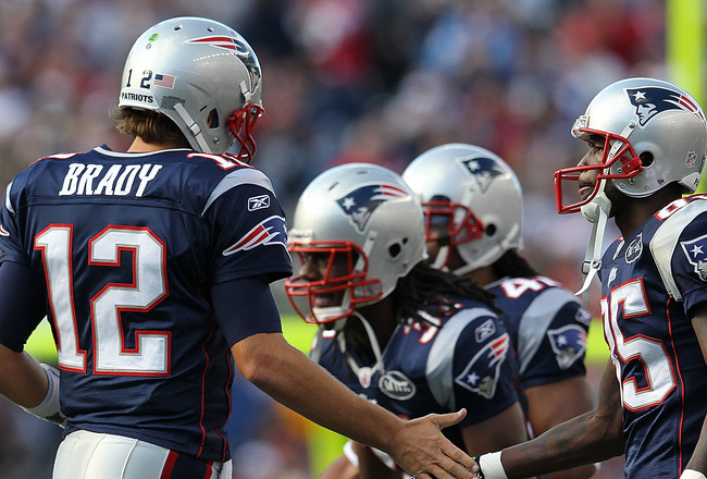 FOXBORO, MA -  SEPTEMBER 18:  Tom Brady #12 of the New England Patriots celebrates a touchdown with  Chad Ochocinco #85 of the New England Patriots during a game with the San Diego Chargers at Gillette Stadium on September 18, 2011 in Foxboro, Massachuset