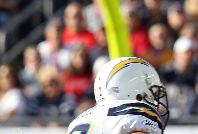 FOXBORO, MA -  SEPTEMBER 18:   Aaron Hernandez #81 of the New England Patriots runs against the defense  Eric Weddle #32 of the San Diego Chargers game at Gillette Stadium on September 18, 2011 in Foxboro, Massachusetts. (Photo by Jim Rogash/Getty Images)