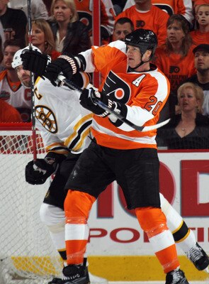 PHILADELPHIA, PA - APRIL 30: Chris Pronger #20 of the Philadelphia Flyers hits Zdeno Chara #33 of the Boston Bruins in Game One of the Eastern Conference Semifinals during the 2011 NHL Stanley Cup Playoffs at the Wells Fargo Center on April 30, 2011 in Ph