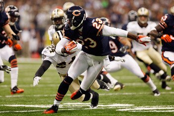 NEW ORLEANS, LA - SEPTEMBER 18:   Devin Hester #23 of the Chicago Bears avoids a tackle by  Leigh Torrence #24 of the New Orleans Saints at Louisiana Superdome on September 18, 2011 in New Orleans, Louisiana.  (Photo by Chris Graythen/Getty Images)