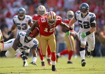 SAN FRANCISCO, CA - SEPTEMBER 11:  Ted Ginn #19 of the San Francisco 49ers breaks a tackled on his way to returning a punt for a touchdown against the Seattle Seahawks during their season opener at Candlestick Park on September 11, 2011 in San Francisco,