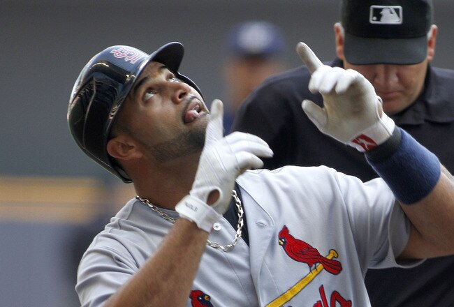 MILWAUKEE, WI - SEPTEMBER 1:  Albert Pujols #5 of the St. Louis Cardinals celebrates a home run in his first at bat during their game against the Milwaukee Brewers at Miller Park on September 1, 2011 in Milwaukee, Wisconsin. (Photo by Mark Hirsch/Getty Im