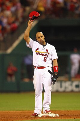 ST. LOUIS, MO - JULY 29: Albert Pujols #5 of the St. Louis Cardinals acknowledges the crowd after collecting his 2,000 career hit, an RBI double against Carlos Marmol #49 of the Chicago Cubs at Busch Stadium on July 29, 2011 in St. Louis, Missouri.  The C