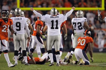 DENVER, CO - SEPTEMBER 12:  Place kicker  Sebastian Janikowski #11 of the Oakland Raiders celebrates his 63 yard field goal with five seconds remaining in the first half to give the Raiders a 16-3 lead over the Denver Broncos at Sports Authority Field at