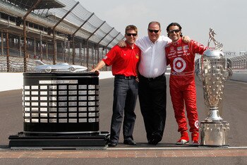 INDIANAPOLIS - MAY 31:  Dario Franchitti (R) of Scotland, driver of the #10 Target Chip Ganassi Racing Dallara Honda, with the Borg Warner Trophy poses with team owner Chip Ganassi (C) and Chip Ganassi Racing NASCAR driver and 2010 Daytona 500 winner Jami