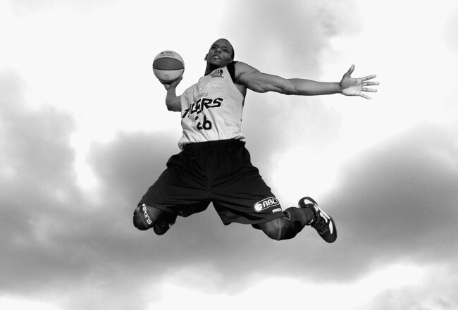 MELBOURNE, AUSTRALIA - AUGUST 11:  (EDITORS NOTE: Image has been converted to black and
white.) Ronald Dorsey of the Tigers slam dunks during a Melbourne Tigers NBL portrait session at their training venue Aegis Park on August 11, 2011 in Melbourne, Austr