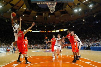NEW YORK - MARCH 08:  Terrence Roberts #33 of the Syracuse Orange defends the shot of Russell Carter #43 of the Notre Dame Fighting Irish during the quarterfinals of the Big East Championship at Madison Square Garden On March 8, 2007 in New York City.  (P