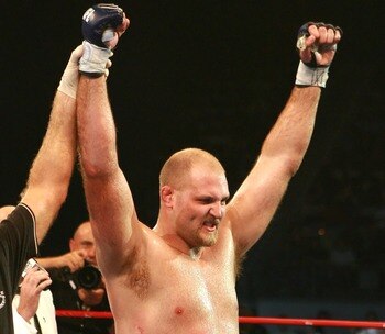 HOLLYWOOD, FL - SEPTEMBER 20:  Ben Rothwell (yellow trunks) celebrates his victory over Ricco Rodriguez during their heavyweight bout during the IFL finals at the Seminole Hard Rock Casino on September 20, 2007 in Hollywood, Florida.  (Photo by Doug Benc/