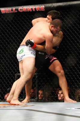 Machida prevents a Rua takedown.