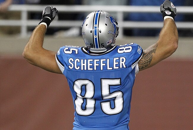 DETROIT, MI - SEPTEMBER 18:  Tony Scheffler #85 of the Detroit Lions pumps his arms after scoring a touchdown against the Kansas City Chiefs at Ford Field on September 18, 2011 in Detroit, Michigan.  (Photo by Dave Reginek/Getty Images)