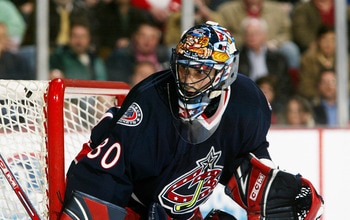 DETROIT - APRIL 7:  Marc Denis #30 of the Columbus Blue Jackets tends goal against the Detroit Red Wings at Joe Louis Arena on April 7, 2006 in Detroit, Michigan. The Red Wings defeated the Blue Jackets 6-5 in a shootout. (Photo by Dave Sandford/Getty Ima