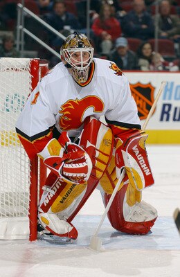 PHOENIX - JANUARY 27:  Goaltender Roman Turek #1 of the Calgary Flames protects the net from the Phoenix Coyotes during the game at Glendale Arena on January 27, 2004 in Glendale, Arizona. The Flames defeated the Coyotes 2-1. (Photo by Barry Gossage via G