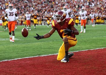 LOS ANGELES - SEPTEMBER 17:   Robert Woods #2 of the USC Trojans flips the ball after scoring on a 31 yard touchdown catch in the second quarter against the Syracuse Orangemen at the Los Angeles Memorial Coliseum on September 17, 2011 in Los Angeles, Cali