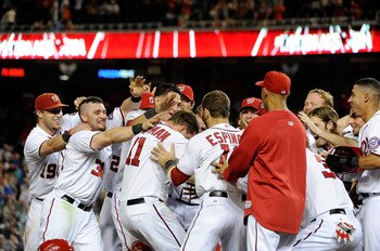 Zimmerman being mobbed at the plate after hitting a walk-off grand slam against the NL East leading Phillies