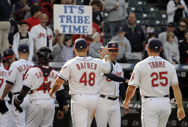 CLEVELAND, OH - SEPTEMBER 24: Designated hitter Travis Hafner #48 of the Cleveland Indians celebrates with manager Manny Acta #11 after the Indians defeated the Minnesota Twins 8-2 at Progressive Field on September 24, 2011 in Cleveland, Ohio. (Photo by J