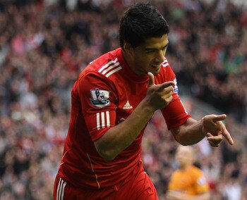 LIVERPOOL, ENGLAND - SEPTEMBER 24:  Luis Suarez of Liverpool celebrates scoring the second goal during the Barclays Premier League match between Liverpool and Wolverhampton Wanderers at Anfield on September 24, 2011 in Liverpool, England.  (Photo by Clive