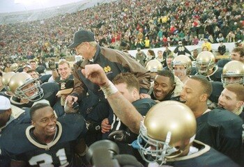 23 Nov1996:  Head coach Lou Holtz of the Notre Dame Fighting Irish is carried off the field by his team after defeating the Rutgers Scarlet Knights 62-0 at Notre Dame Stadium in South Bend, Indiana.  Mandatory Credit: Jonathan Daniel/Allsport