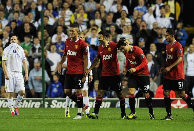 LEEDS, ENGLAND - SEPTEMBER 20:  Ryan Giggs of Manchester United celebrates with Fabio Da Silva after scoring his team's third goal during the Carling Cup Third Round match between Leeds United and Manchester United at Elland Road on September 20, 2011 in