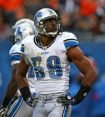 CHICAGO - OCTOBER 04: Julian Peterson #59 of the Detroit Lions looks at the replay board during a game against the Chicago Bears on October 4, 2009 at Soldier Field in Chicago, Illinois. The Bears defeated the Lions 48-24. (Photo by Jonathan Daniel/Getty