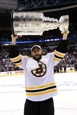 VANCOUVER, BC - JUNE 15:  Rich Peverley #49 celebrates with the Stanley Cup after defeating the Vancouver Canucks in Game Seven of the 2011 NHL Stanley Cup Final at Rogers Arena on June 15, 2011 in Vancouver, British Columbia, Canada. The Boston Bruins de