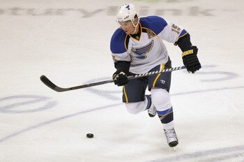 DENVER, CO - SEPTEMBER 23:  Jamie Langenbrunner #15 of the St. Louis Blues controls the puck against the Colorado Avalanche during their preseason game at Pepsi Center on September 23, 2011 in Denver, Colorado.  (Photo by Doug Pensinger/Getty Images)