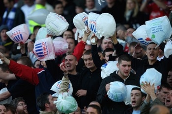 LIVERPOOL, UNITED KINGDOM - OCTOBER 20:  Liverpool fans make fun of the Everton fans by showing Tescos carrier bags during the Barclays Premier League match between Everton and Liverpool  at Goodison Park on October 20, 2007 in Liverpool, England.  (Photo