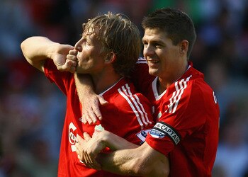 LIVERPOOL, ENGLAND - MAY 24:  Dirk Kuyt of Liverpool celebrates with Steven Gerrard after his deflected shot went in for the second goal during the Barclays  Premier League match between Liverpool and Tottenham Hotspur at Anfield on May 24, 2009 in Liverp