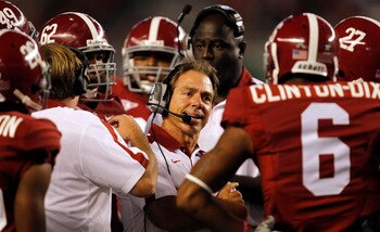 TUSCALOOSA, AL - SEPTEMBER 17:  Coach Nick Saban of the Alabama Crimson Tide talks with defensive players during a timeout in a game against North Texas on September 17, 2011 at Bryant-Denny Stadium in Tuscaloosa, Alabama. (Photo by Butch Dill/Getty Image