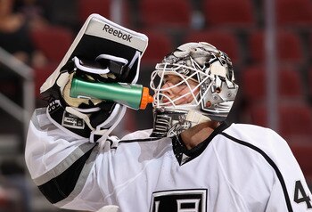 GLENDALE, AZ - SEPTEMBER 21:  Goaltender Jonathan Bernier #45 of the Los Angeles Kings drinks from a gatorade bottle during the preseason NHL game against the Phoenix Coyotes at Jobing.com Arena on September 21, 2011 in Glendale, Arizona. The Kings defeat