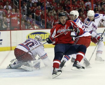 WASHINGTON, DC - APRIL 13: Alexander Semin #28 of the Washington Capitals is tripped up in his game against the New York Rangers in Game One of the Eastern Conference Quarterfinals during the 2011 NHL Stanley Cup Playoffs at Verizon Center on April 13, 20