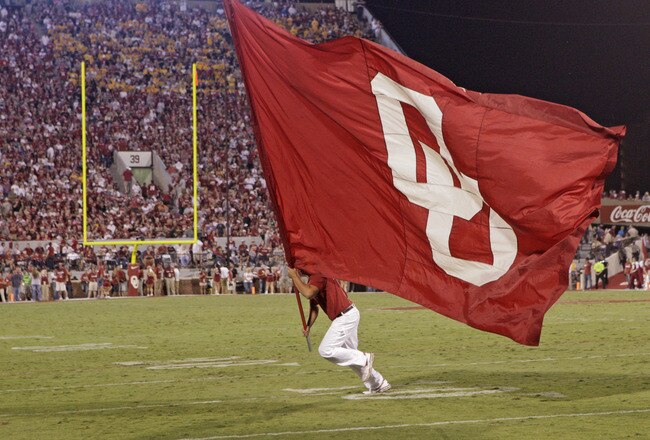 NORMAN, OK - SEPTEMBER 24:  A member of the Oklahoma Sooner spirit squad the RUF/NEKS celebrates a Sooner touchdown against the Missouri Tigers on September 24, 2011 at Gaylord Family-Oklahoma Memorial Stadium in Norman, Oklahoma.  Oklahoma defeated Misso