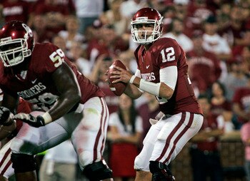 NORMAN, OK - SEPTEMBER 24:  Quarterback Landry Jones #12 of the Oklahoma Sooners looks to throw against the Missouri Tigers on September 24, 2011 at Gaylord Family-Oklahoma Memorial Stadium in Norman, Oklahoma.  Oklahoma defeated Missouri 34-14.  (Photo b